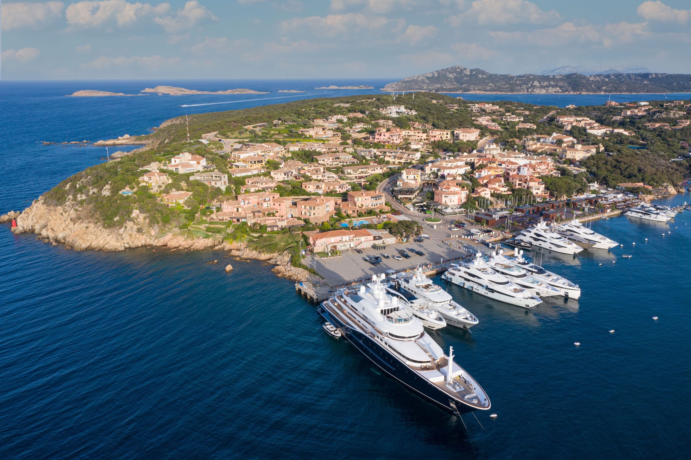 Marina with yachts and hillside villas
